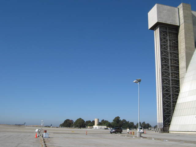 Eddy towers next to huge blimp hangar