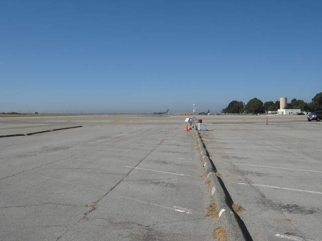 long shot of eddy tower on runway apron looking upwind