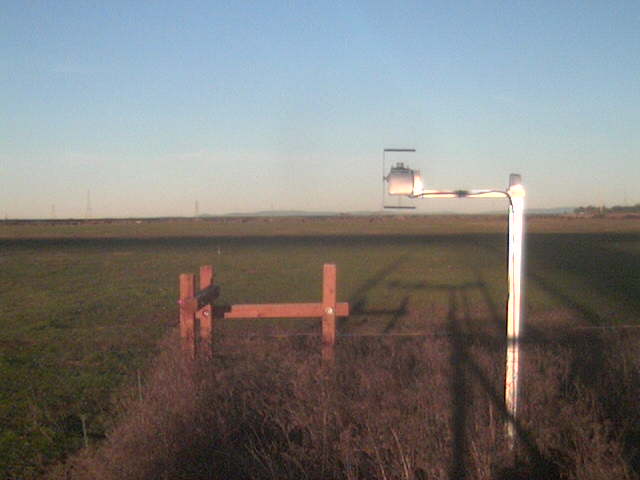 Bridge shadows on the field.