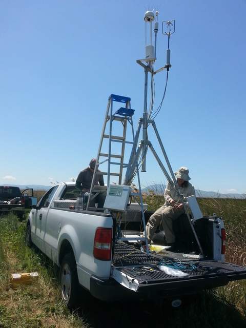 Setting up the portable tower on the back of Dennis