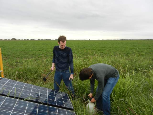 Sam and Pascal cleaning solar panels at Aflalfa