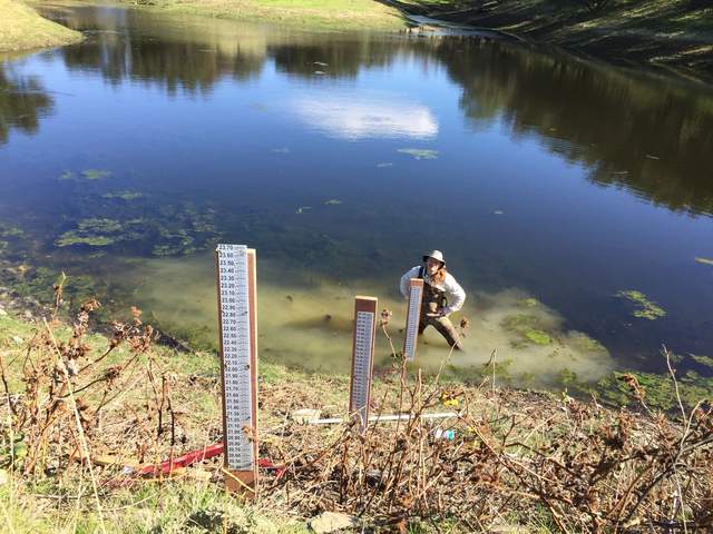 Set of three gauges (and Joe!) to monitor the water level in the large pond northeast of our tower site
