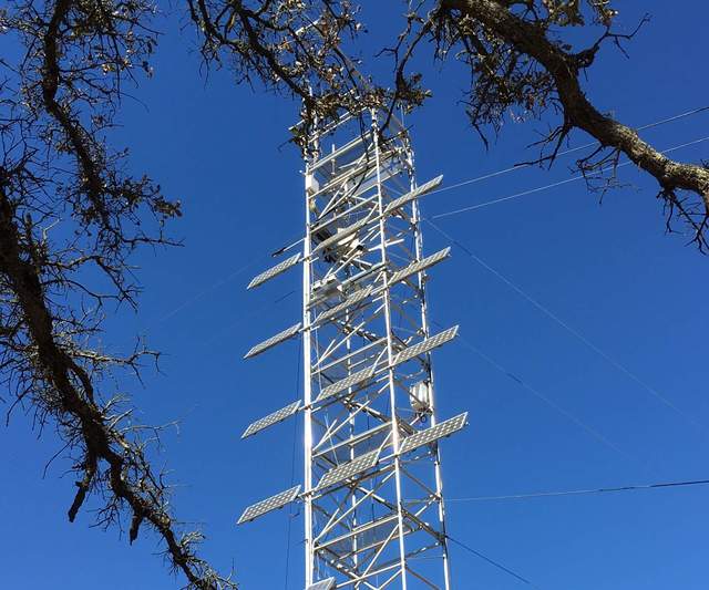 JPL equipment just visible on the Tower above the second from top solar panel
