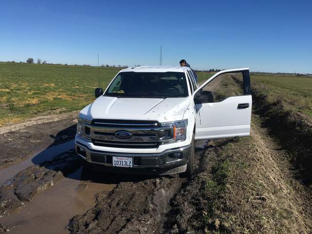 Our rental 4x4 stuck in the mud, on the dirt road south of the old