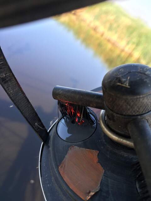 One of the fluorometer brushes blocking the lens with the visible red light. 