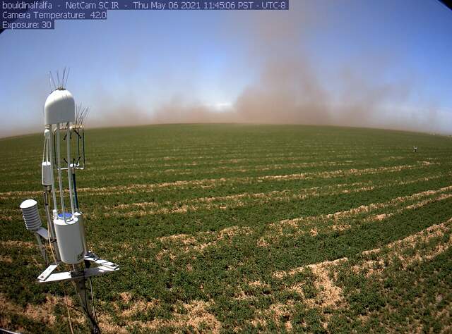 Dust kicked up from driving on dirt roads