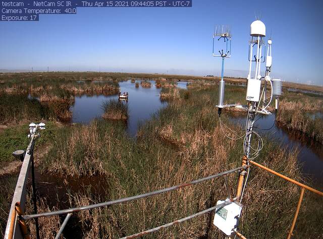 Camilo, Ari, and Julie sampling open water location