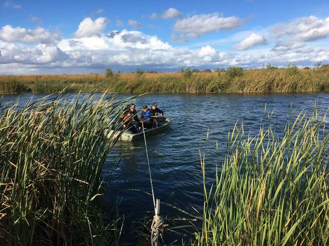 Robert, Koong, and Ari navigating the boat back to the southern bank during the 24hr tidal sampling campaign