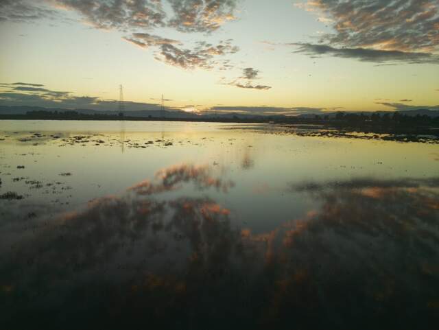 Sunset and clouds reflected in the water