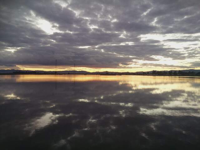 Reflected clouds at sunset