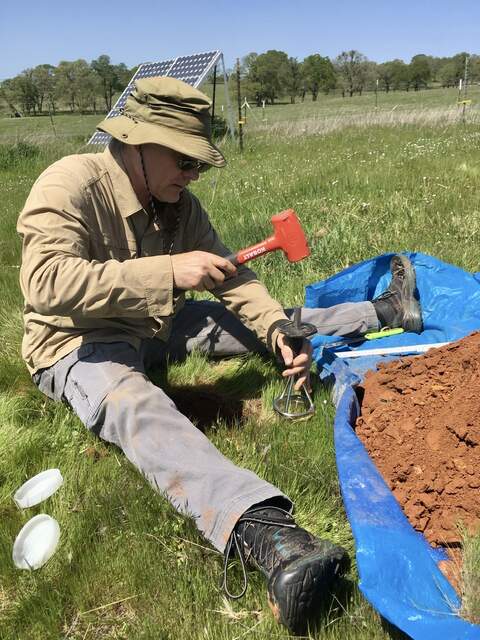 Joe taking surface soil core at pit 2 from AMP soil samples