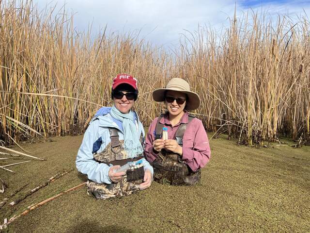 Kyle and Daphne sampling dissolved gas during Kuno