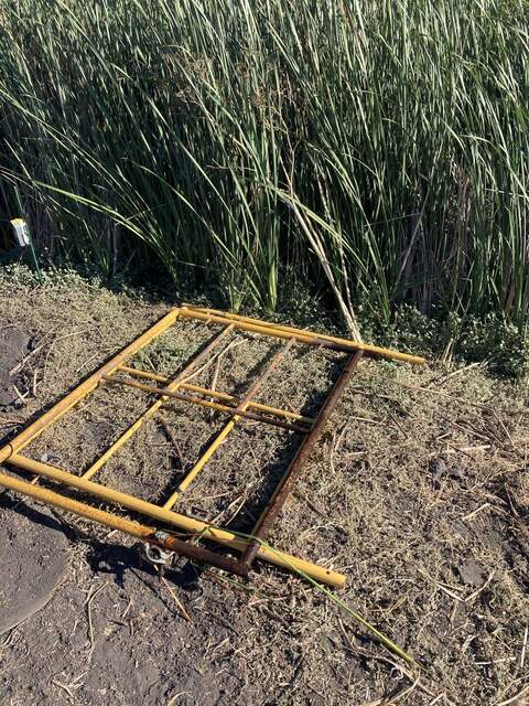 Rusted frame removed from Mayberry, compared to a fresh scaffolding layer.