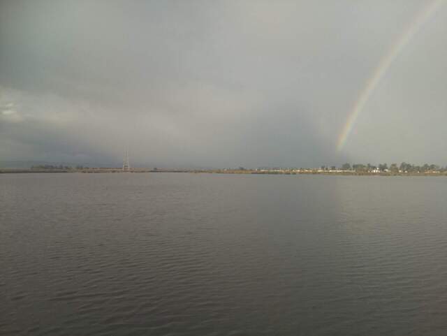 Rainbow over the flooded wetland