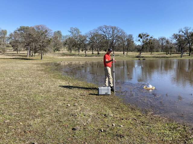 Kuno doing CO2/CH4 floating chamber fluxes on the Tonzi pond